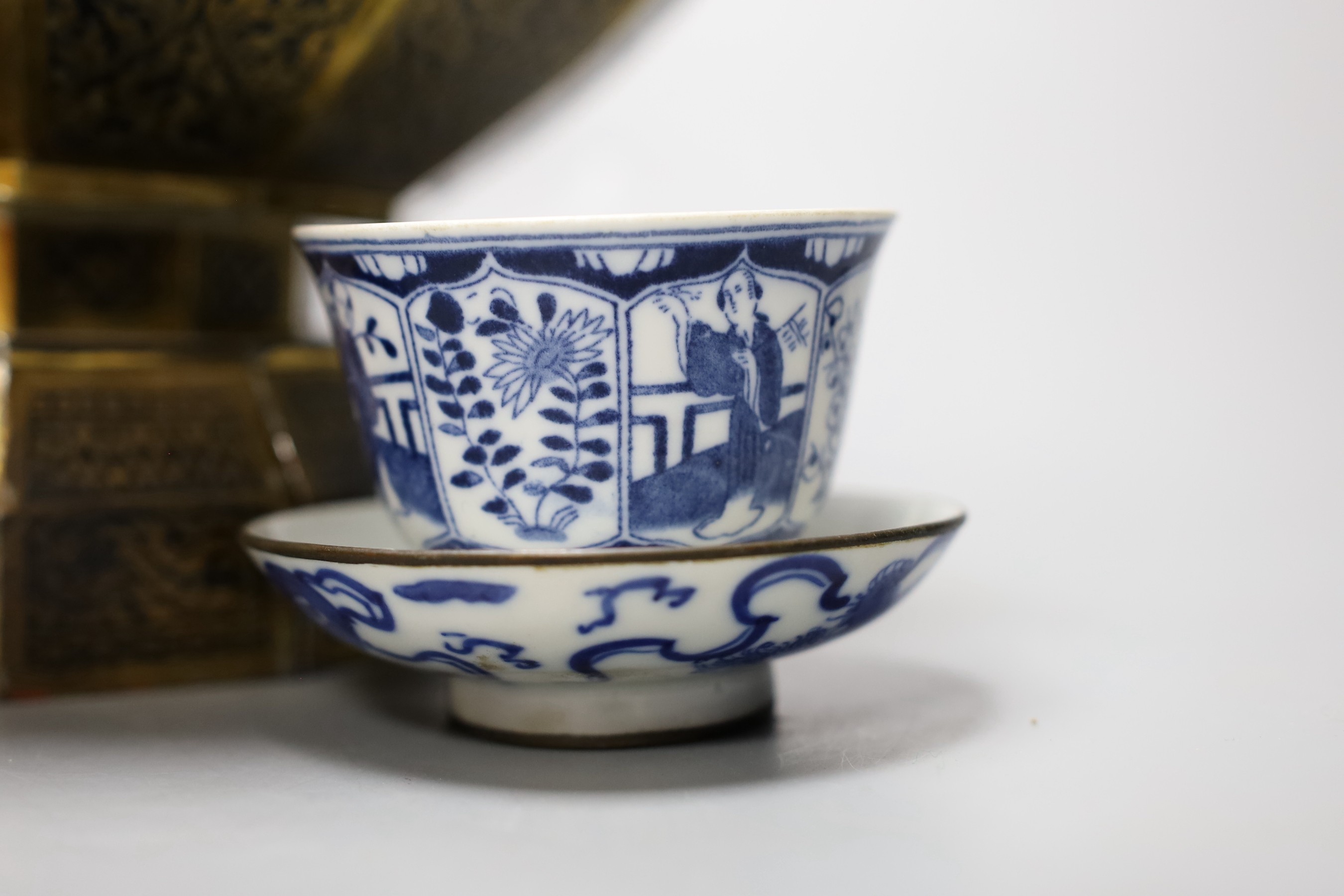 A collection of Chinese blue and white tea bowls, a vase, metal planter and book on Hong Kong by John and Veronica Stericker, (7)
